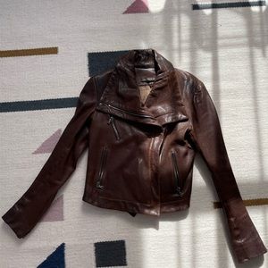 Dark brown leather jacket.